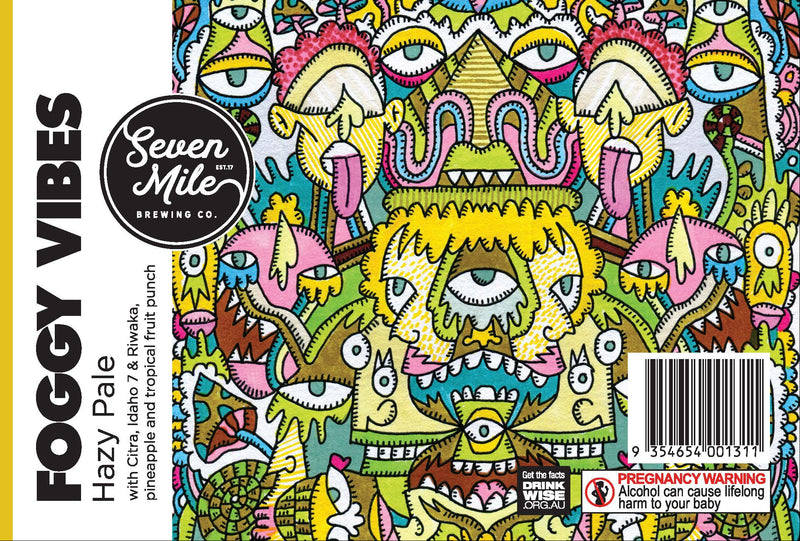 Front and spine of a beer label for Seven Mile Brewing Co's 'Foggy Vibes' Hazy Pale Ale, featuring a highly detailed, colorful psychedelic illustration of a monster face on the front and a yellow spine panel with product details.